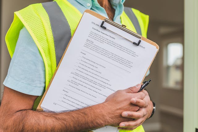 a-person-with-an-inspection-checklist